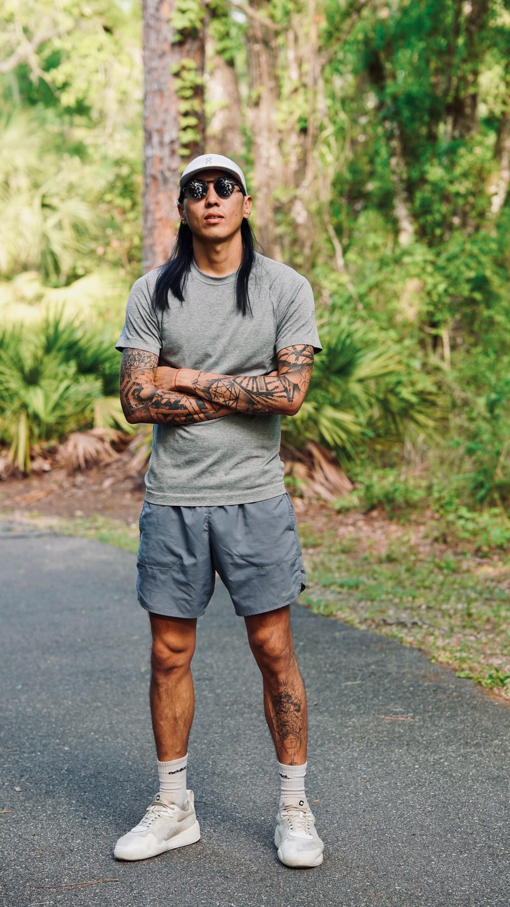 Will Pei Yuan, full length, standing on a trail in a grey T-shirt and cap